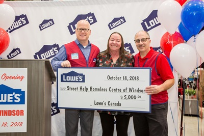 Lowe's executives present cheque to Christine Wilson-Furlonger of Street Help Homeless Centre of Windsor